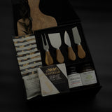 side view of luxury charcuterie gift box with Lynn and Liana Designs cheese knives and Handfuel everything bagel cashews