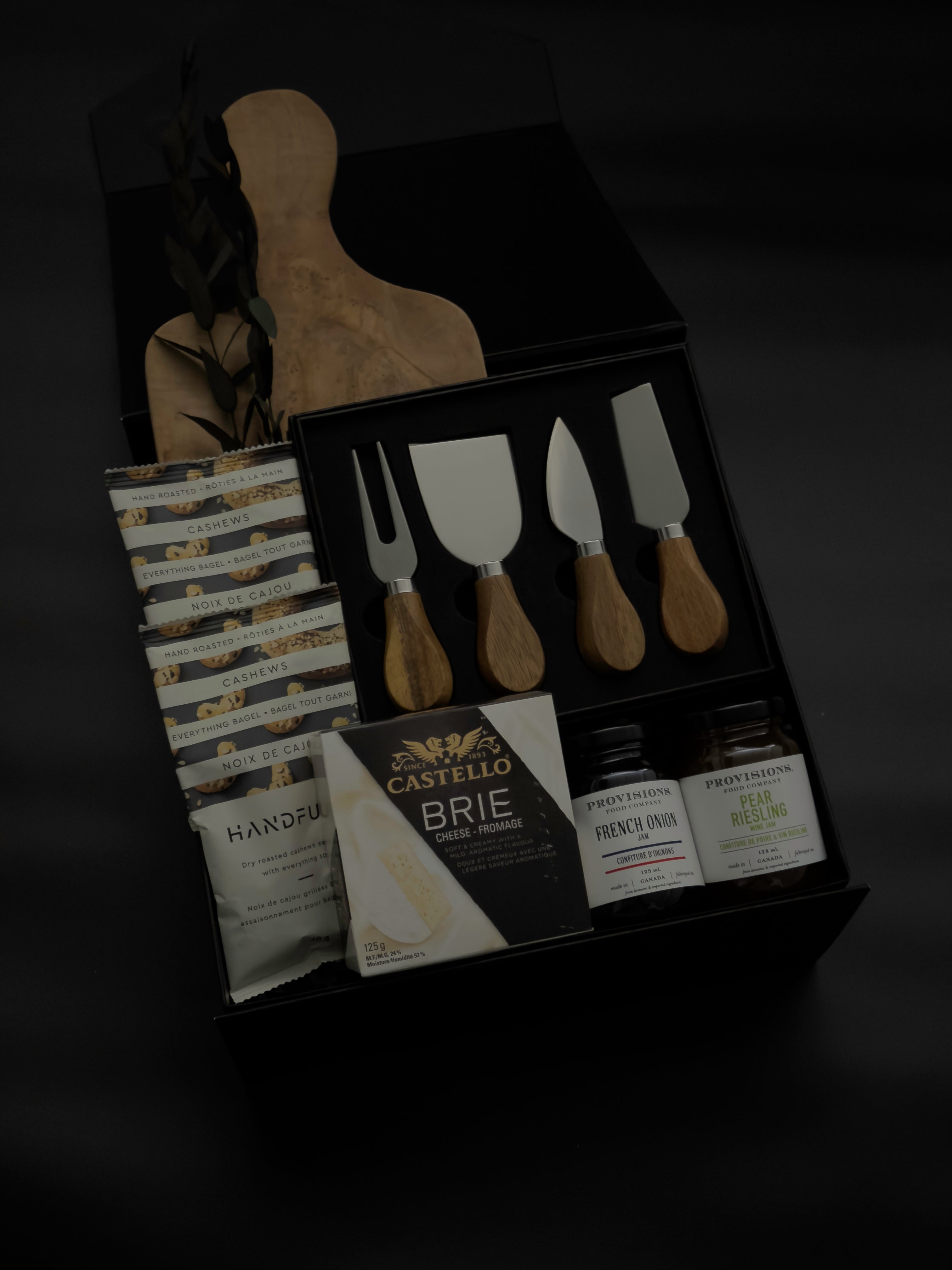 side view of luxury charcuterie gift box with Lynn and Liana Designs cheese knives and Handfuel everything bagel cashews