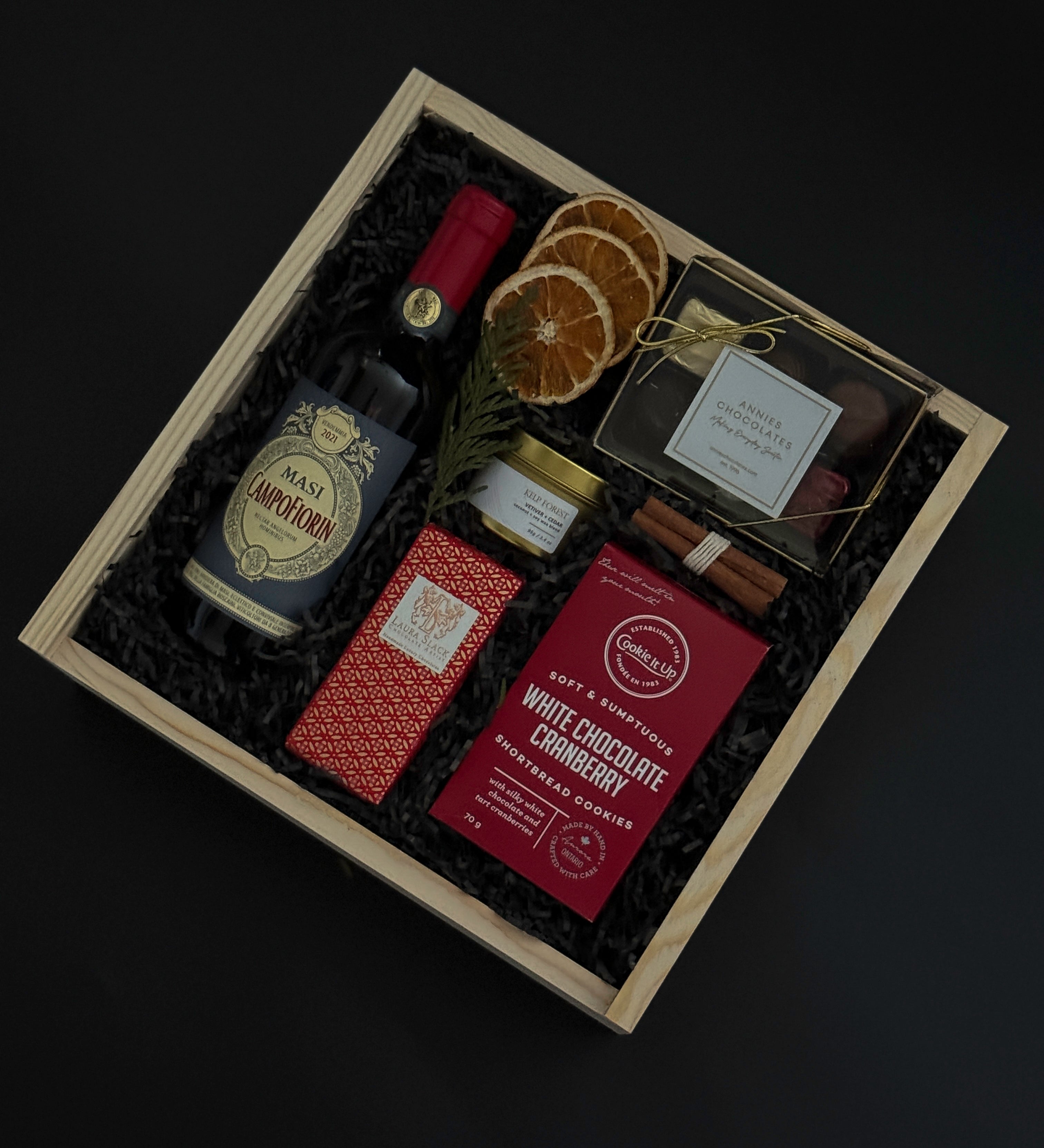 Dolce Notte holiday gift box with Masi Campofiorin red wine, chocolates, and festive accents.