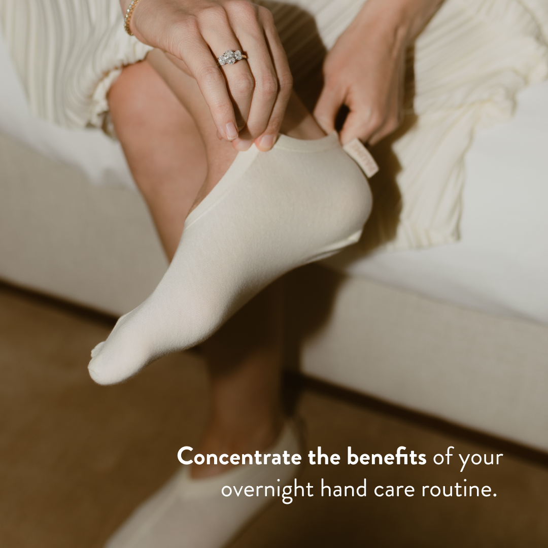 Person wearing a cotton sock with text about overnight hand care routine.