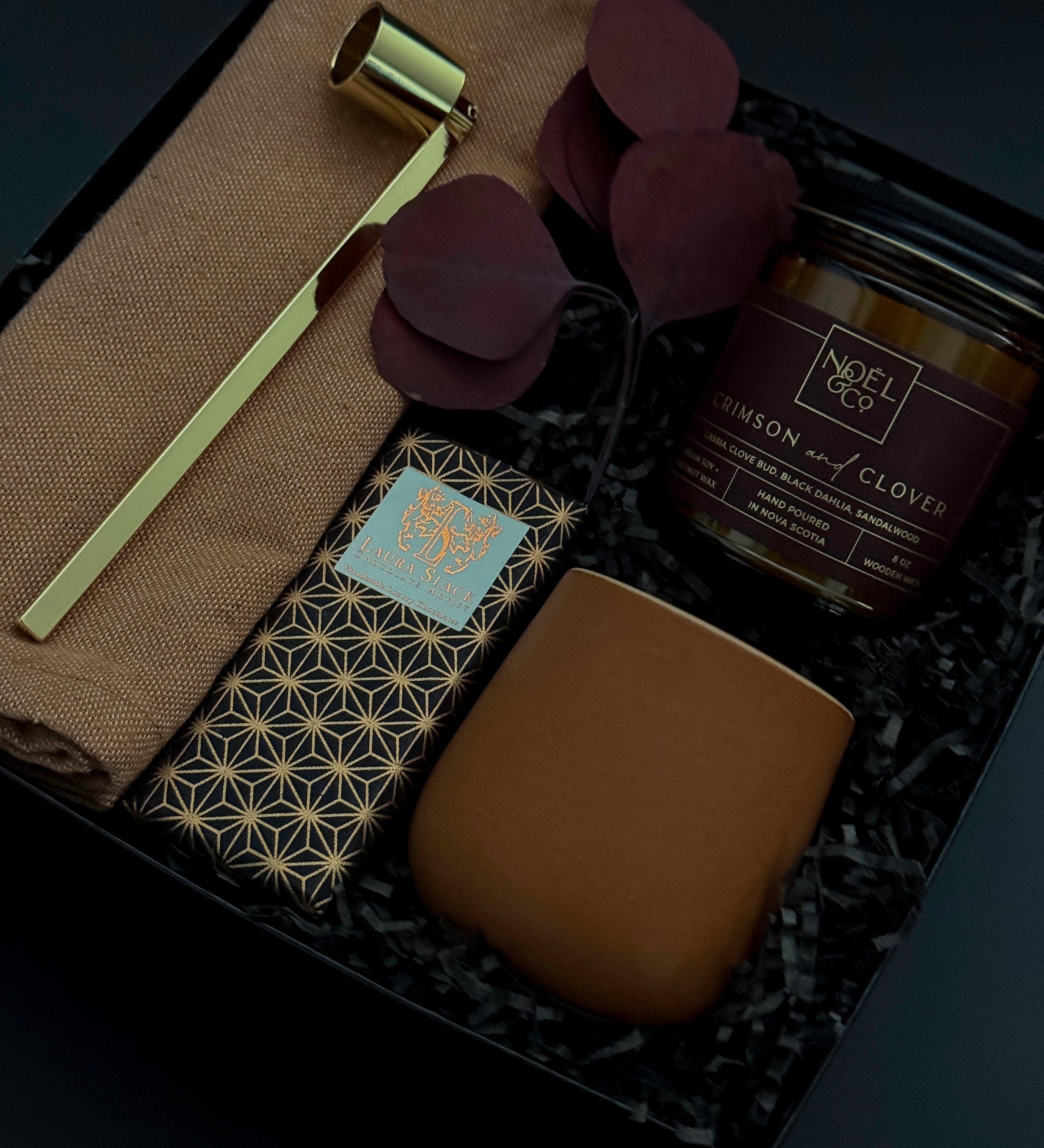 Corporate holiday gift box featuring candle, Japanese Chiyogami chocolate, and gold candle snuffer.