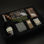 St. James Reserve by Muse Baskets and Co., an executive holiday gift with Mission Hill Brut, candle, caramels, nuts and playing cards.