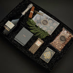 St. James Reserve by Muse Baskets and Co. featuring Annie’s salted caramels, roasted nuts and Theory 11 playing cards in an onyx gift box.