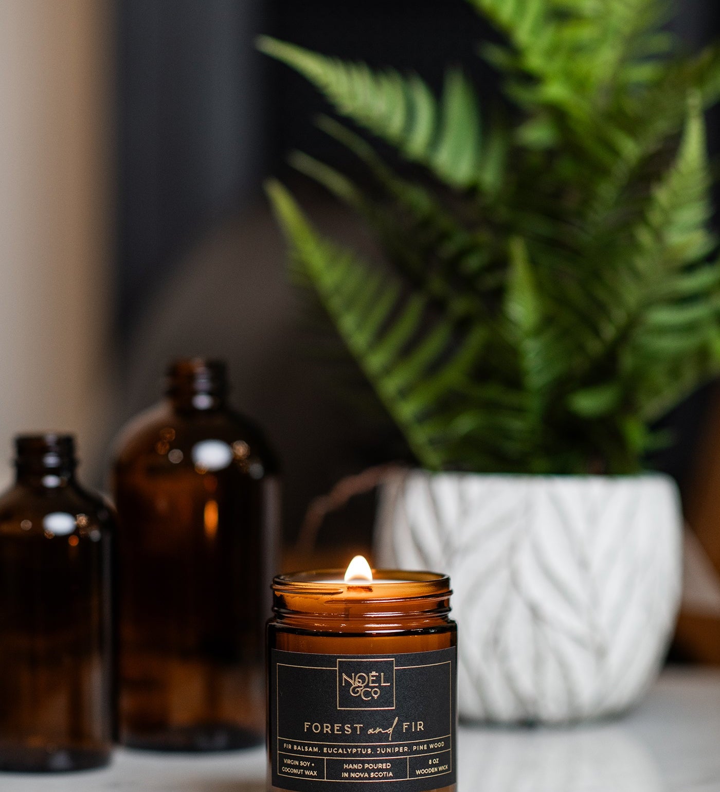 Noel & Co Candle on a marble table 