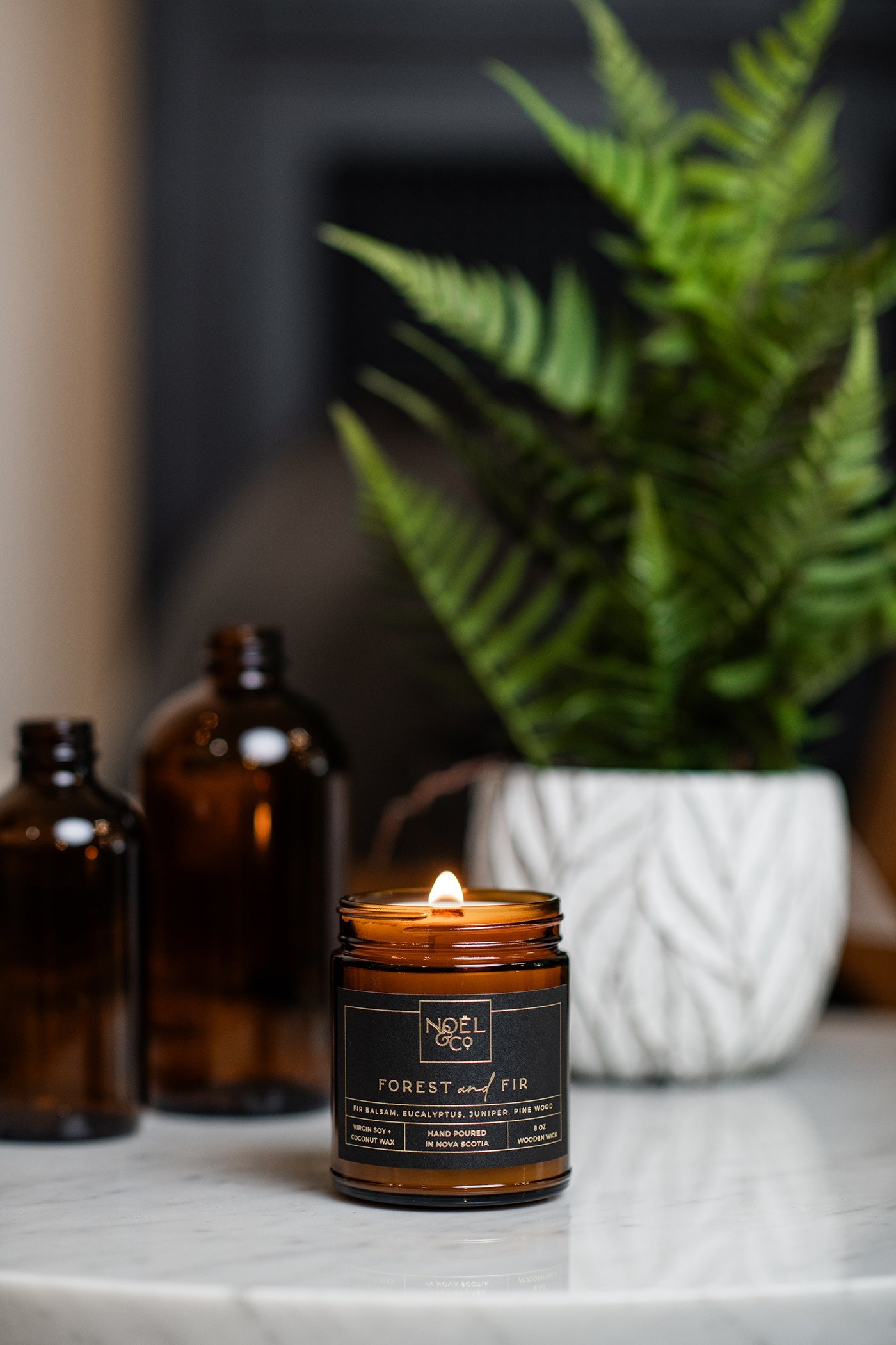 Noel & Co Candle on a marble table 