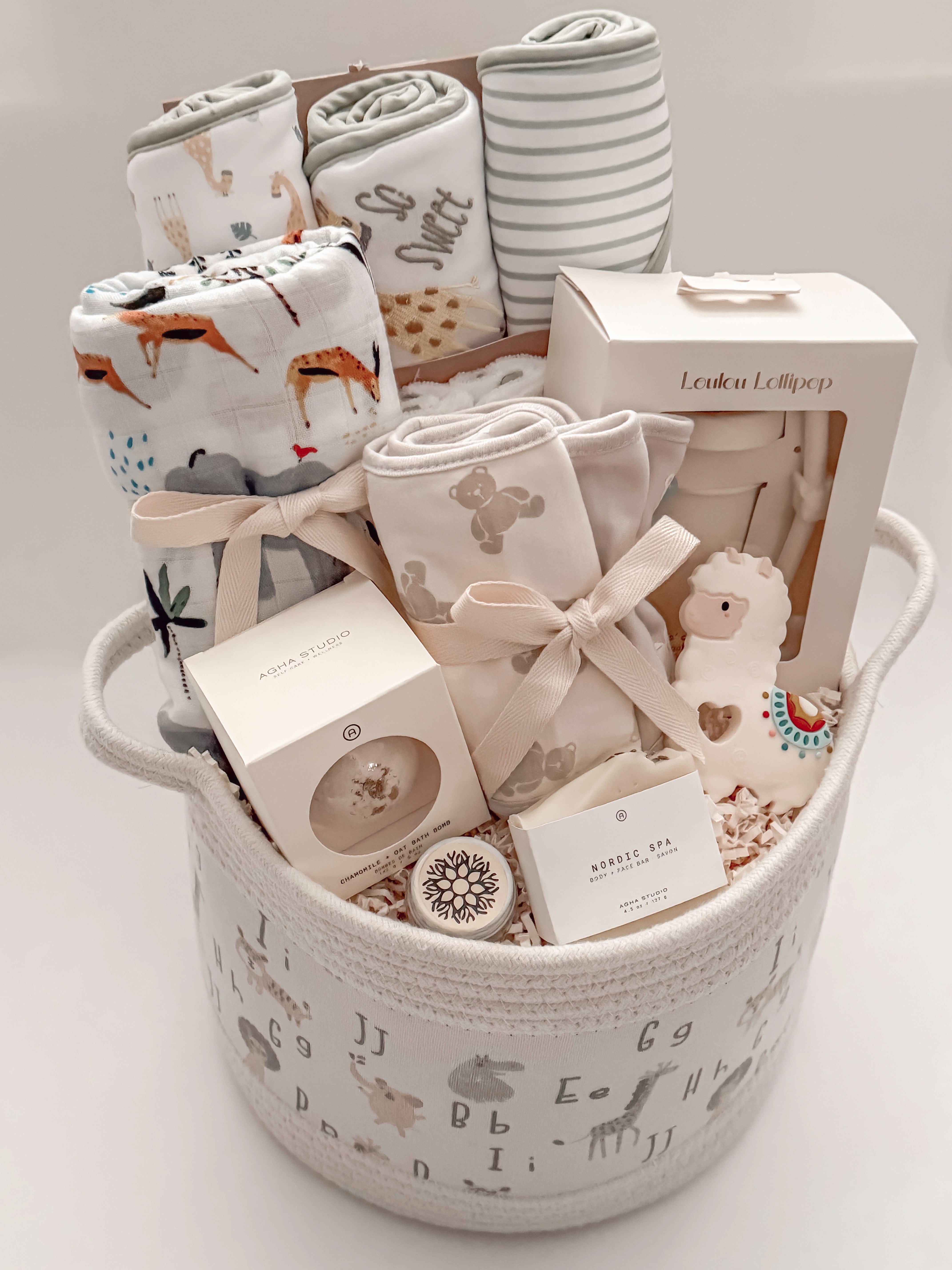 Luxury gender-neutral newborn gift basket with baby bath essentials, swaddle and keepsake basket