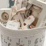 Neutral baby shower gift basket with Loulou Lollipop swaddle, teether and baby accessories