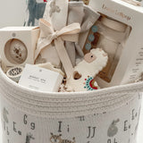 Neutral baby shower gift basket with Loulou Lollipop swaddle, teether and baby accessories