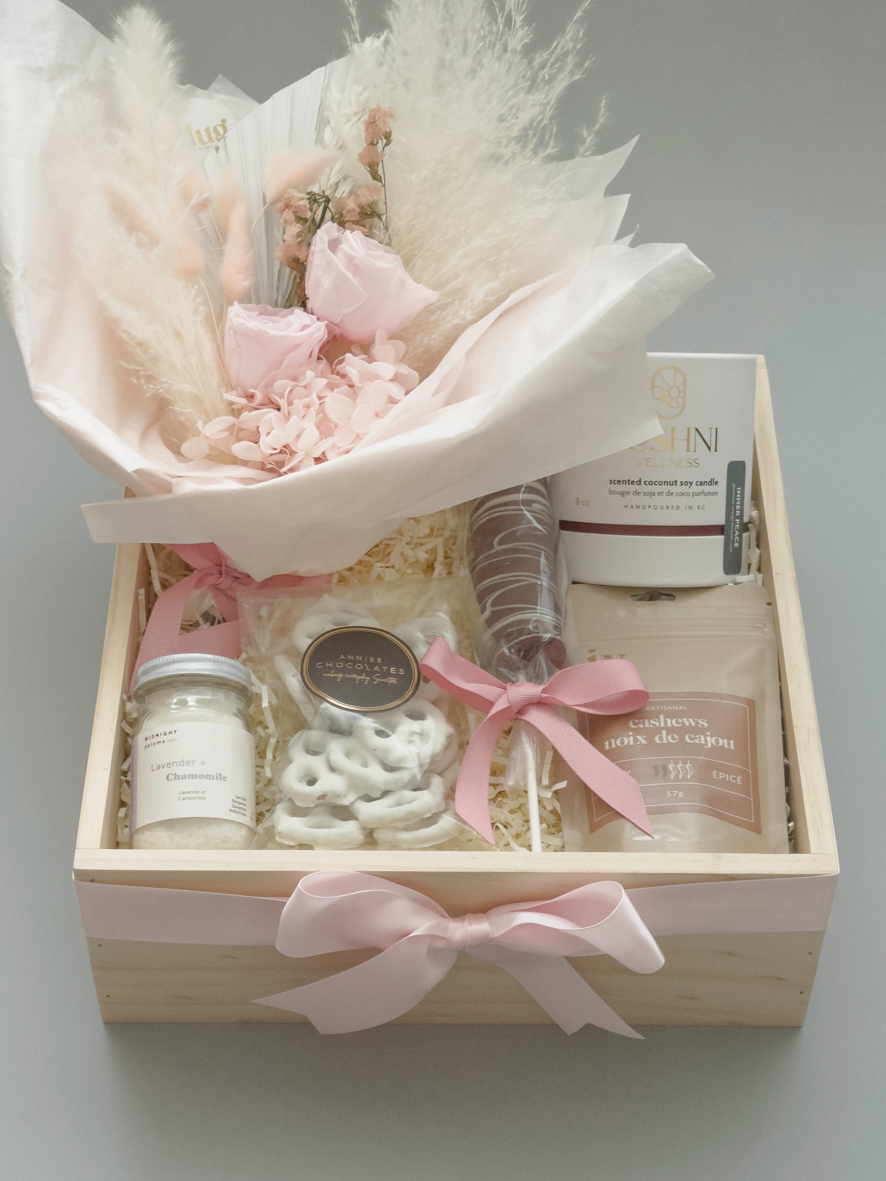 La Vie en Rose gift basket for her with Roshni Wellness candle Midnight Paloma bath salts and Liv Artisanal cashews in natural wood keepsake box