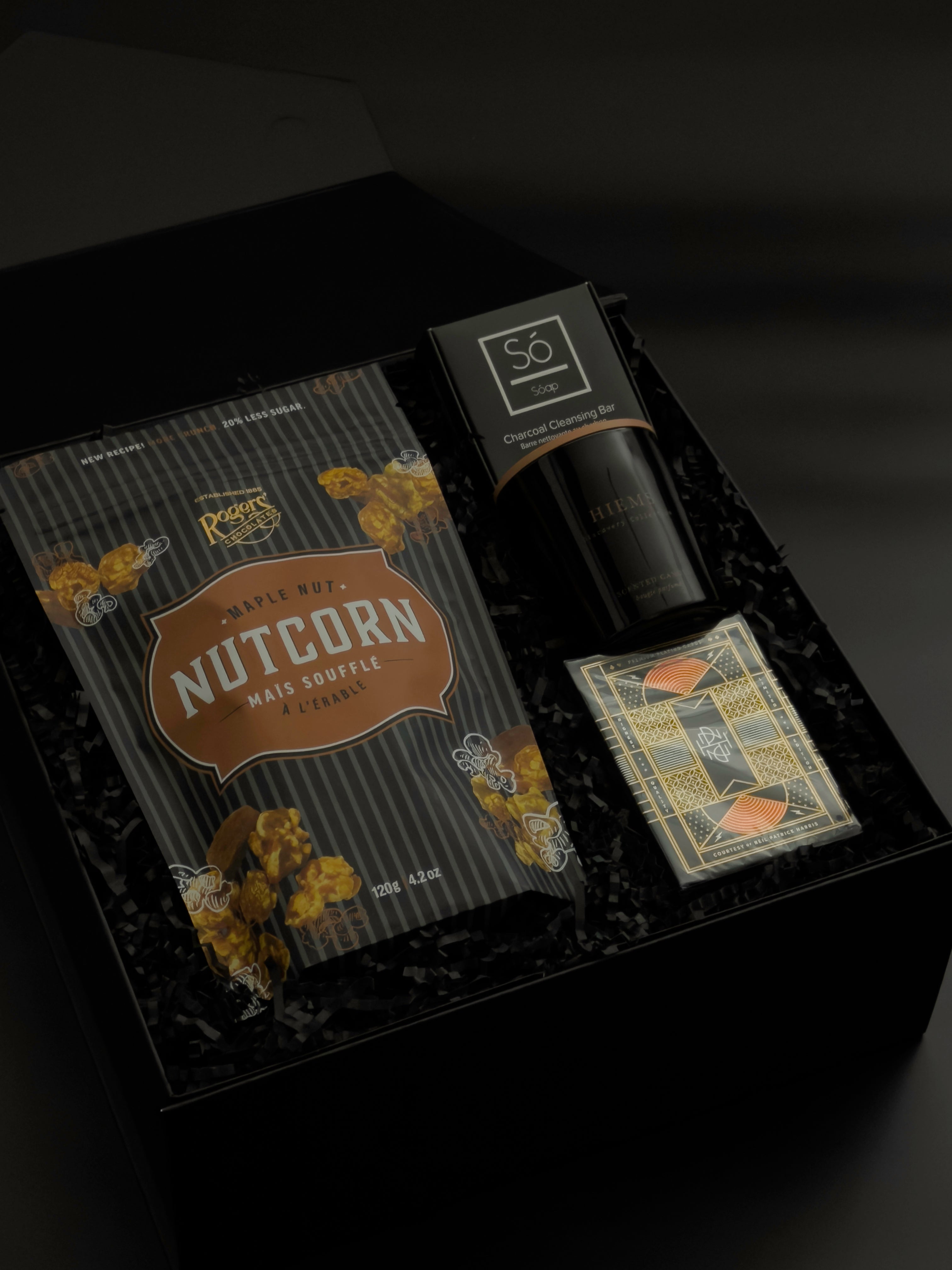 Dark tonal corporate gift box with Vancouver artisan products and premium packaging