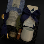Elegant holiday wellness gift box with tea, chocolate, honey, and stoneware mug — perfect for client and corporate gifting.