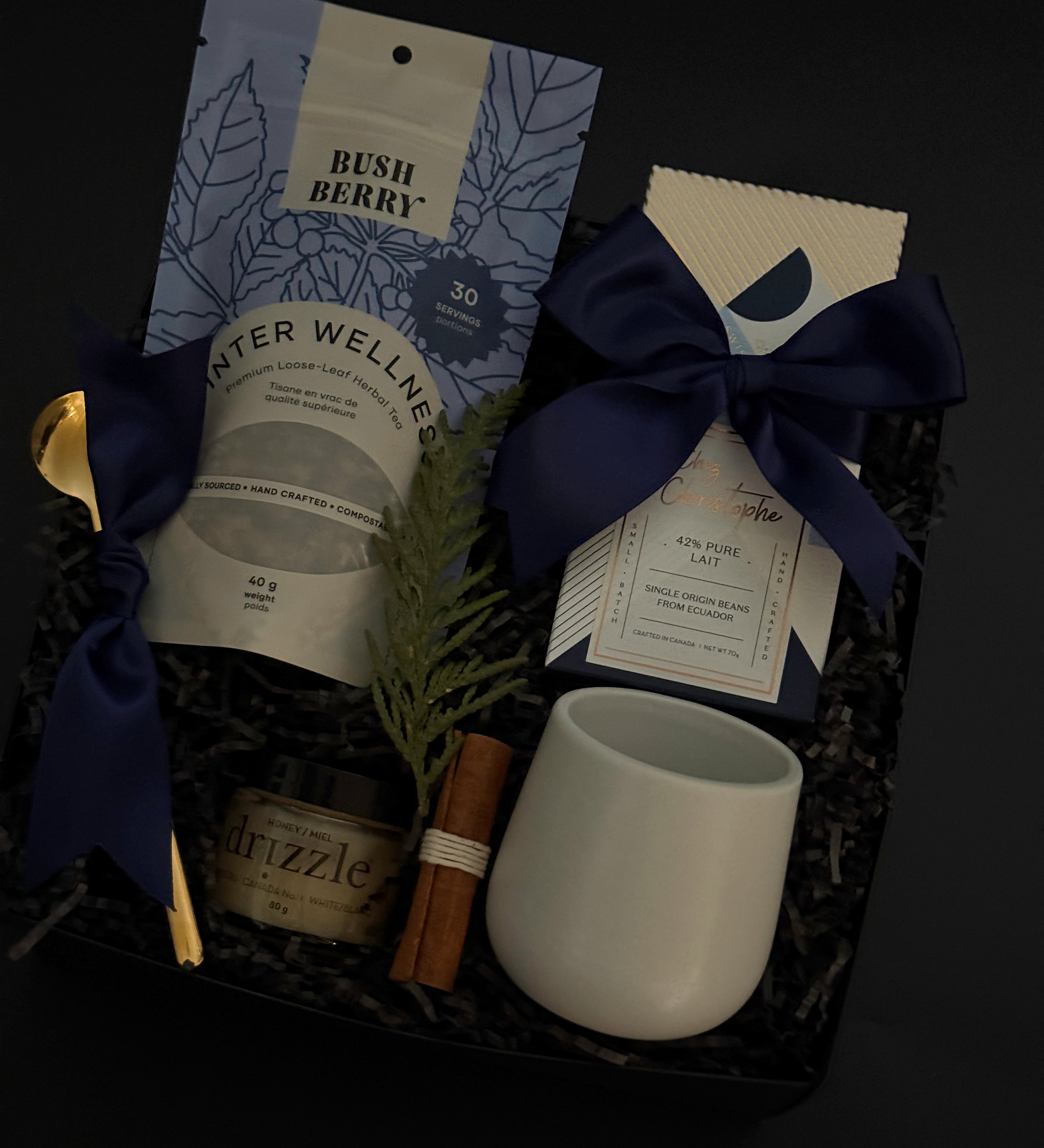 Elegant holiday wellness gift box with tea, chocolate, honey, and stoneware mug — perfect for client and corporate gifting.