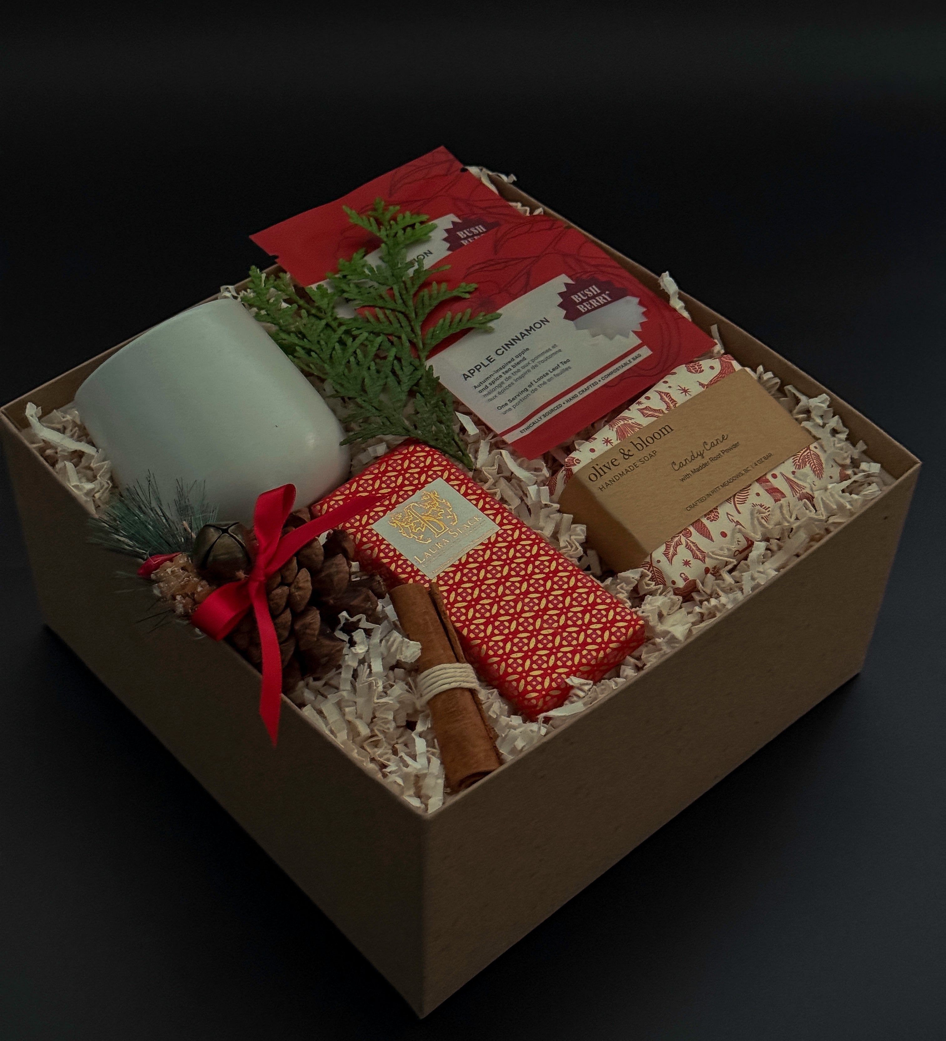Cinnamon Grove holiday gift box with apple cinnamon tea, artisan chocolate, and festive accents.