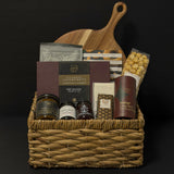 Luxury gourmet gift basket with acacia board, artisan foods, and holiday treats