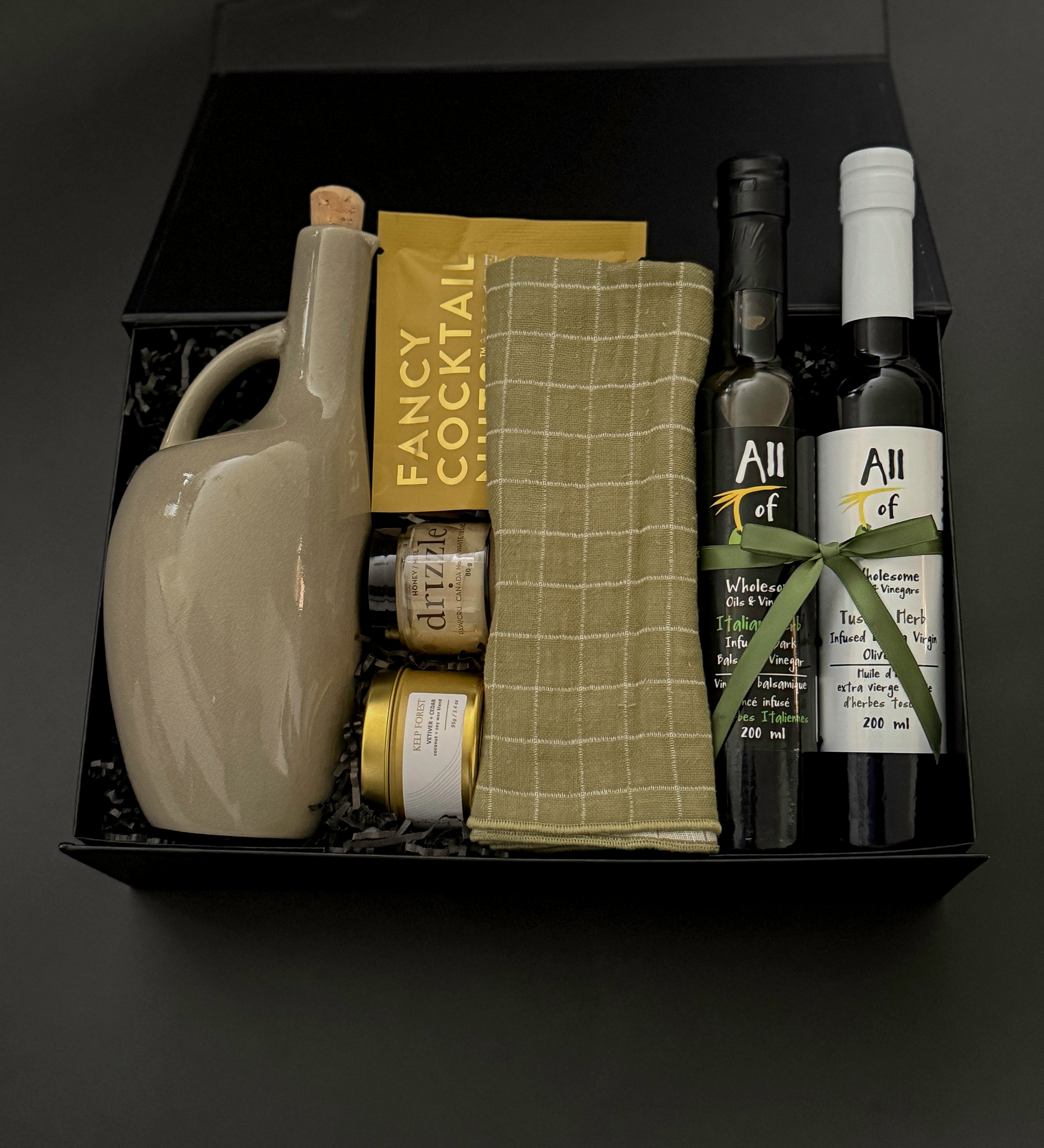 Corporate gourmet gift box with olive oil, balsamic vinegar, almonds, and honey.
