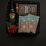 Holiday gift box with Baileys, artisan hot chocolate, and cookies.