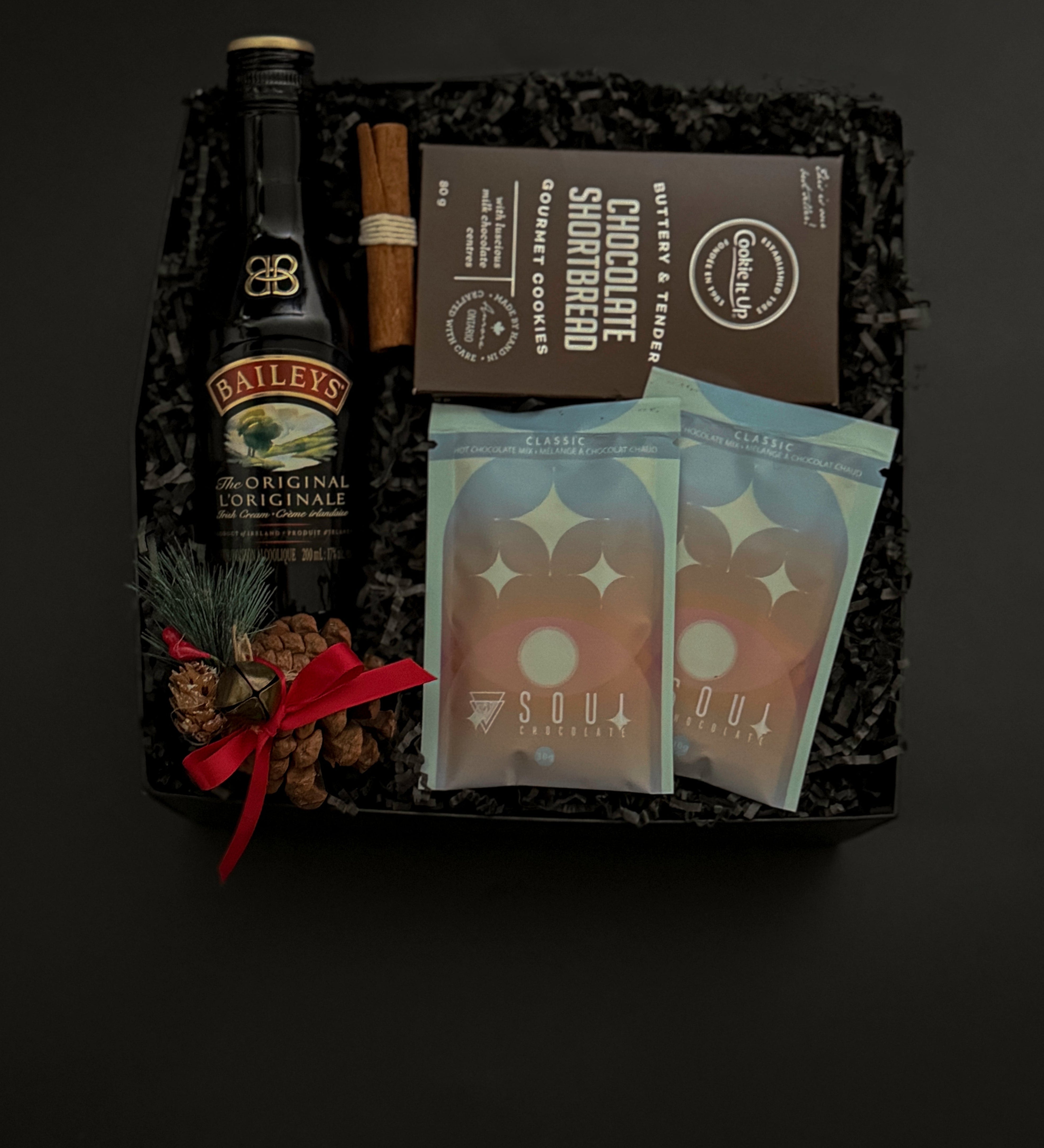 Holiday gift box with Baileys, artisan hot chocolate, and cookies.