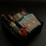 Corporate holiday gift with Baileys, shortbread cookies, and festive accents.