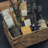 Modern housewarming gift basket with premium Canadian chocolates, caramel popcorn, honey, and candle curated for an elevated city welcome