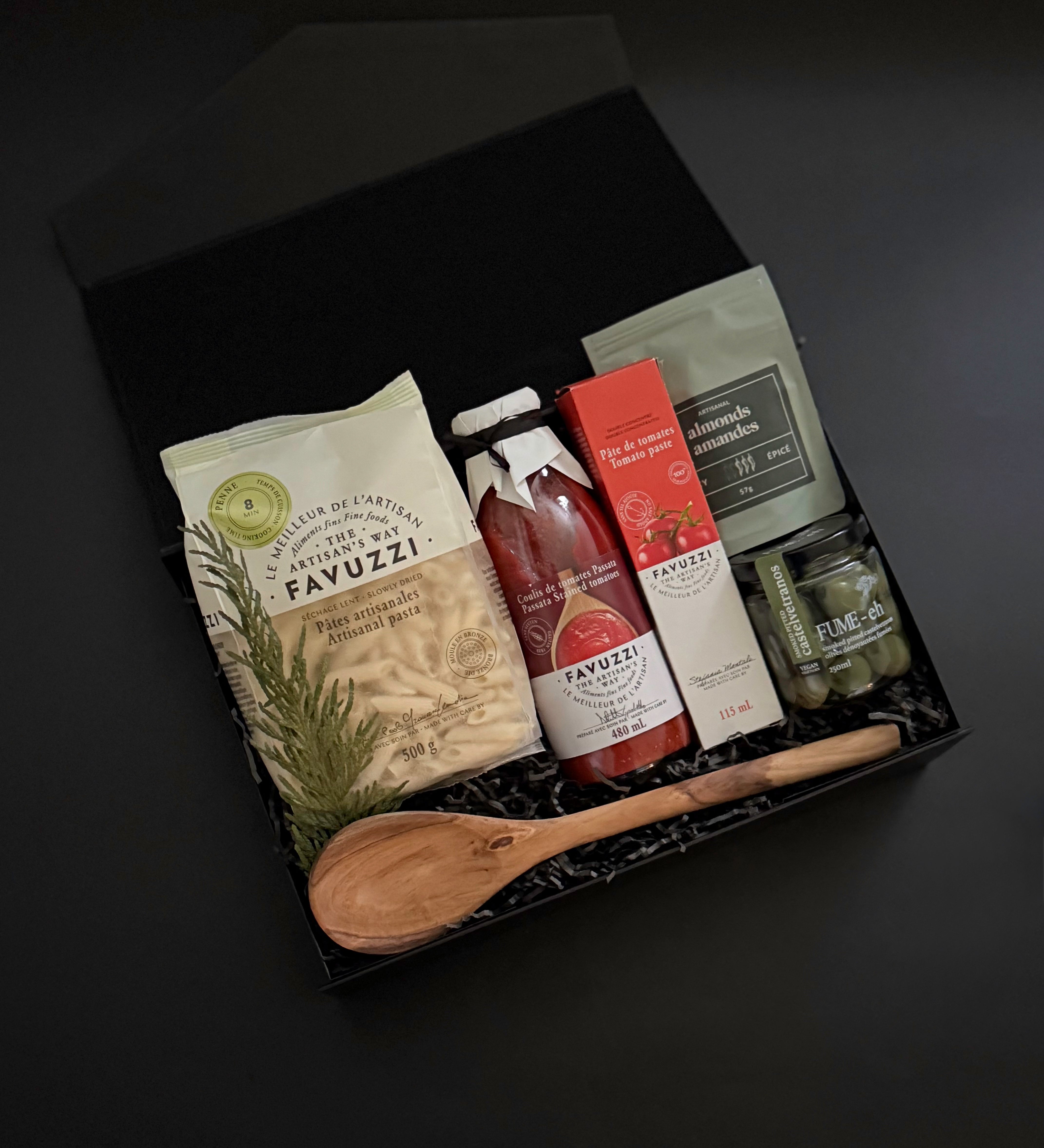 Close-up of Favuzzi artisanal pasta and passata bottles — showcasing premium Italian ingredients with refined labels.