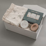 A thoughtfully curated baby gift box featuring Canadian artisan brands. Soft, neutral, and made for the earliest days of new life.