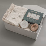 A thoughtfully curated baby gift box featuring Canadian artisan brands. Soft, neutral, and made for the earliest days of new life.