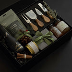 The Luxe Charcuterie Box with sparkling wine, artisan spreads, and cheese knives by Muse Baskets and Co.
