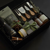 The Luxe Charcuterie Box with sparkling wine, artisan spreads, and cheese knives by Muse Baskets and Co.