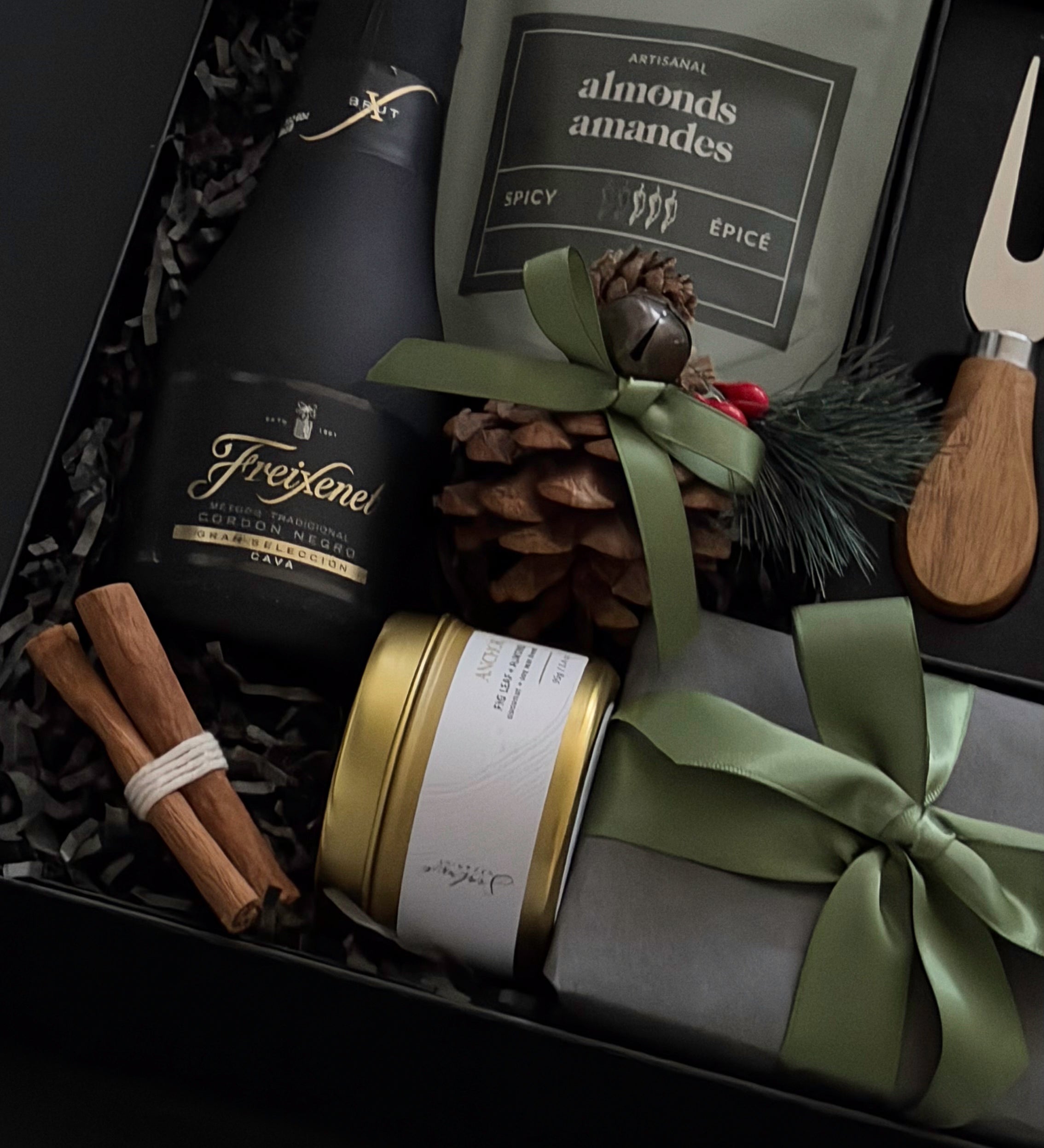 Gift set with wine, nuts, and decorative items in a box