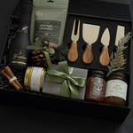 Luxury wine and cheese gift box featuring handcrafted Canadian products and festive touches.