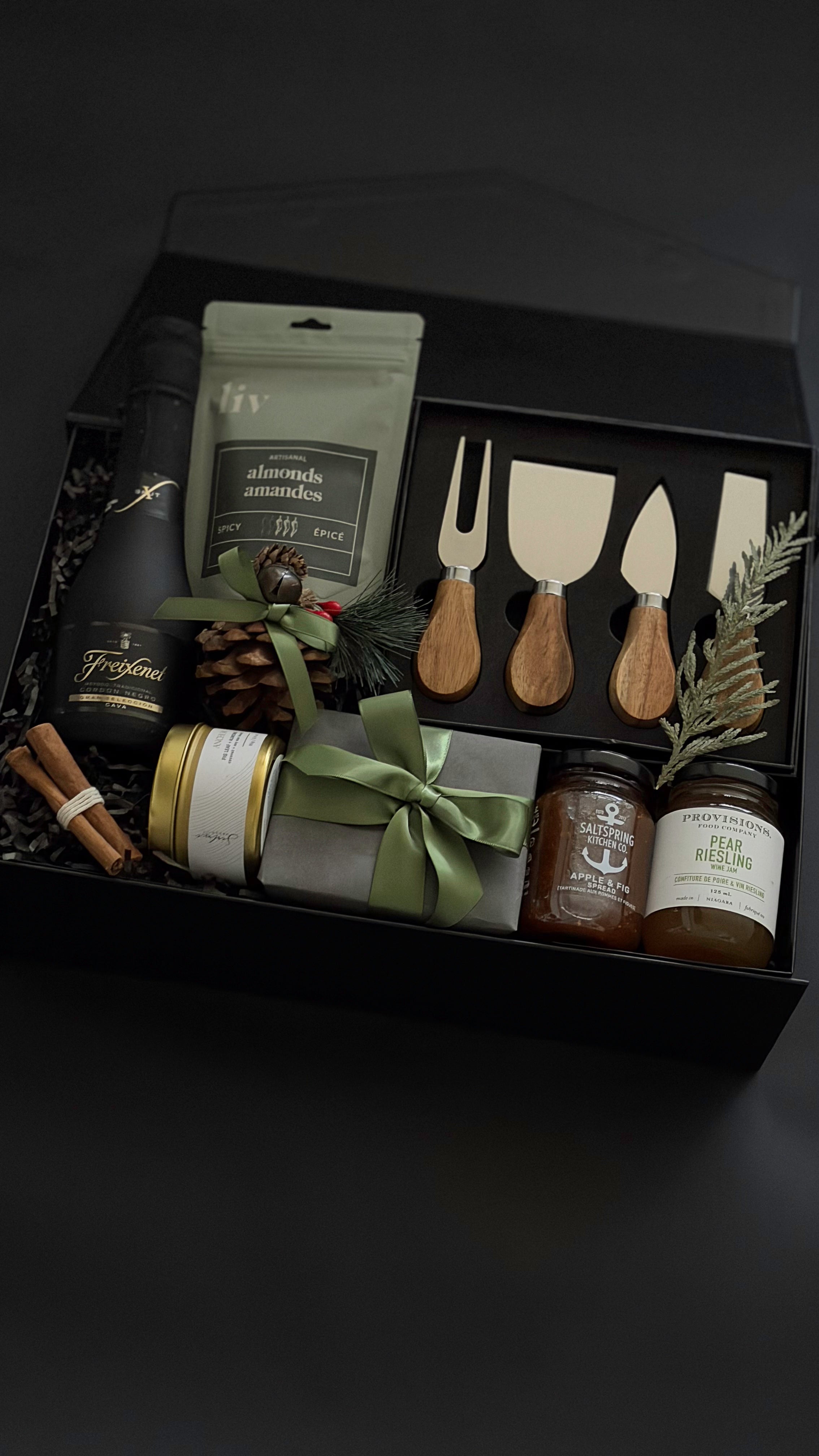 Luxury wine and cheese gift box featuring handcrafted Canadian products and festive touches.
