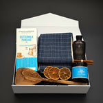 The Chalet Breakfast holiday gift box by Muse Baskets and Co. with pancake mix, maple syrup and blueberry jam in a pearl white box.