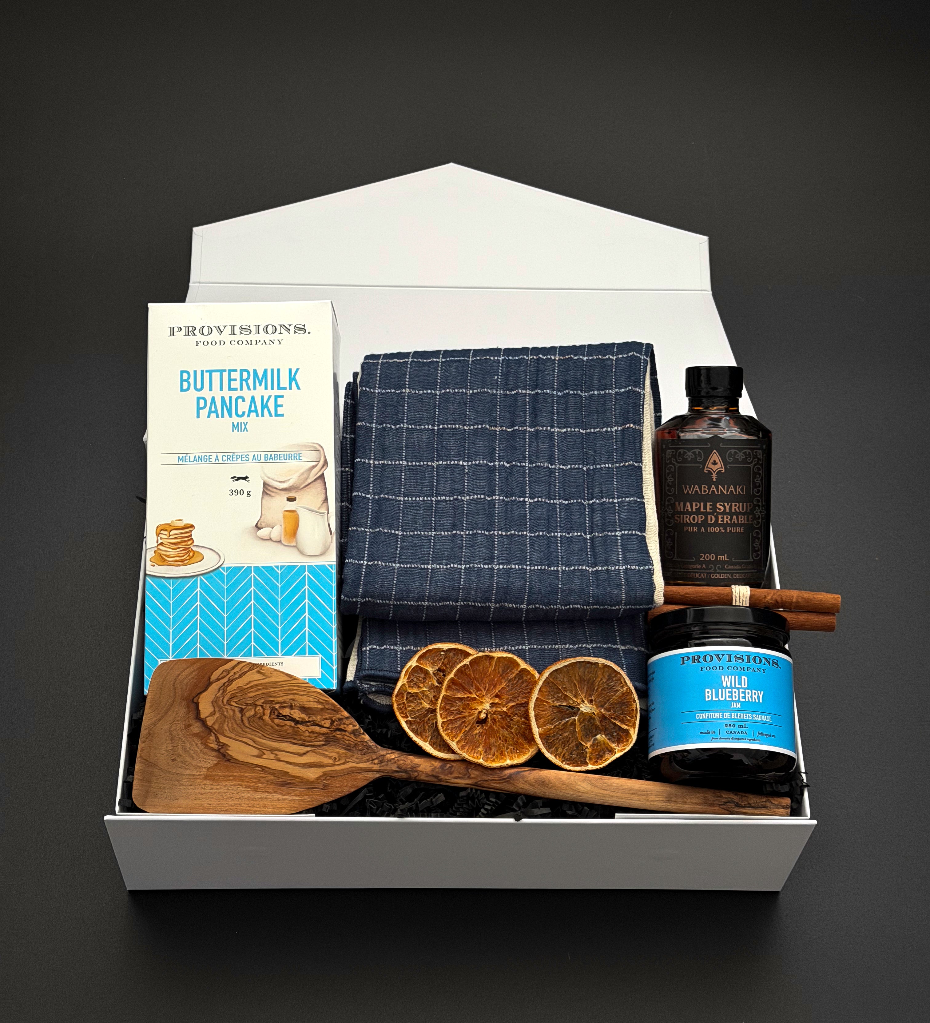 The Chalet Breakfast holiday gift box by Muse Baskets and Co. with pancake mix, maple syrup and blueberry jam in a pearl white box.
