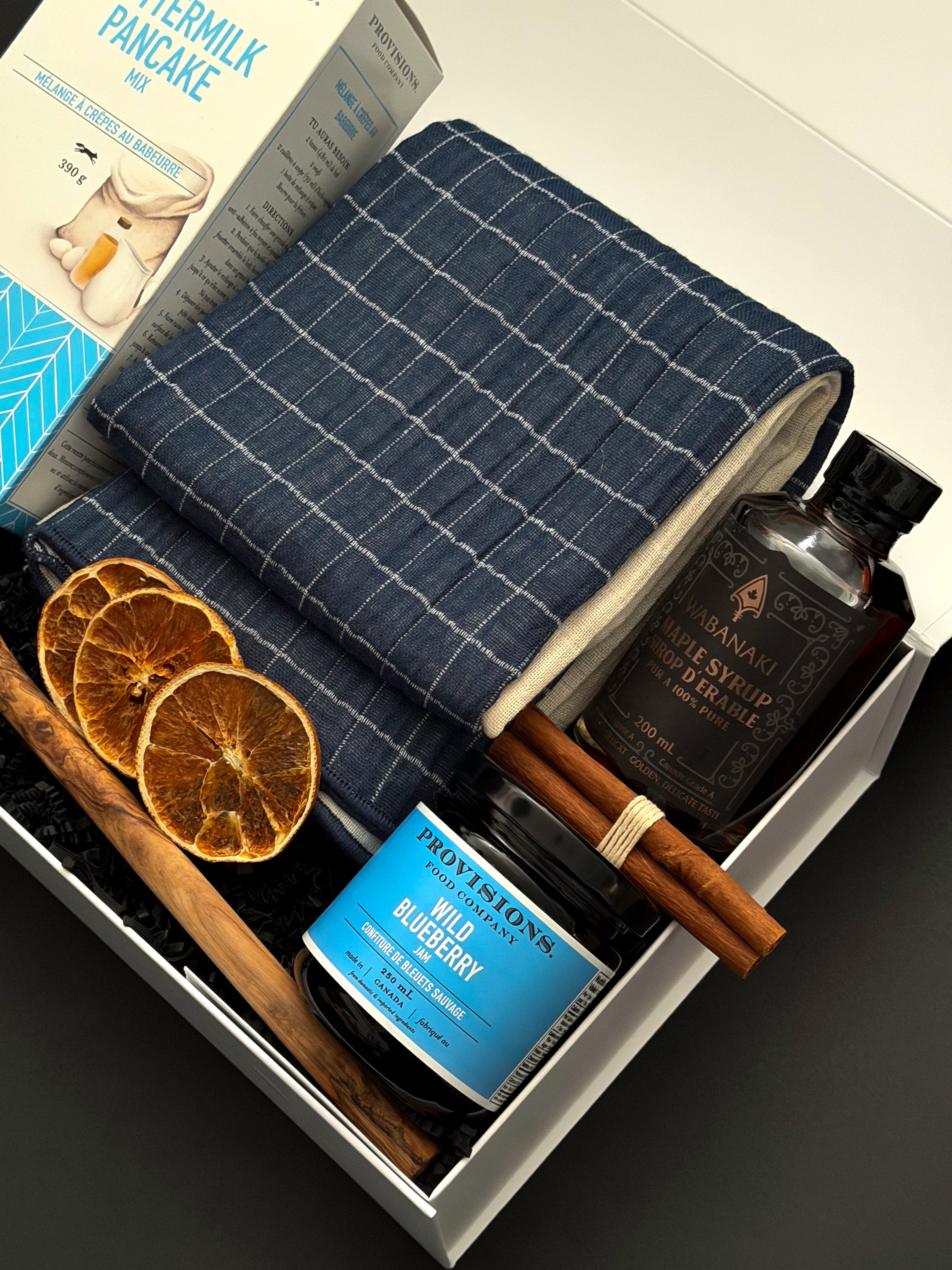The Chalet Breakfast by Muse Baskets and Co., a corporate holiday gift box with Wabanaki maple syrup and Provisions pancake mix.