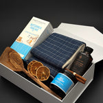 Open pearl white breakfast gift box by Muse Baskets and Co. with blueberry jam, dried orange accents and cinnamon styling for holiday gifting.