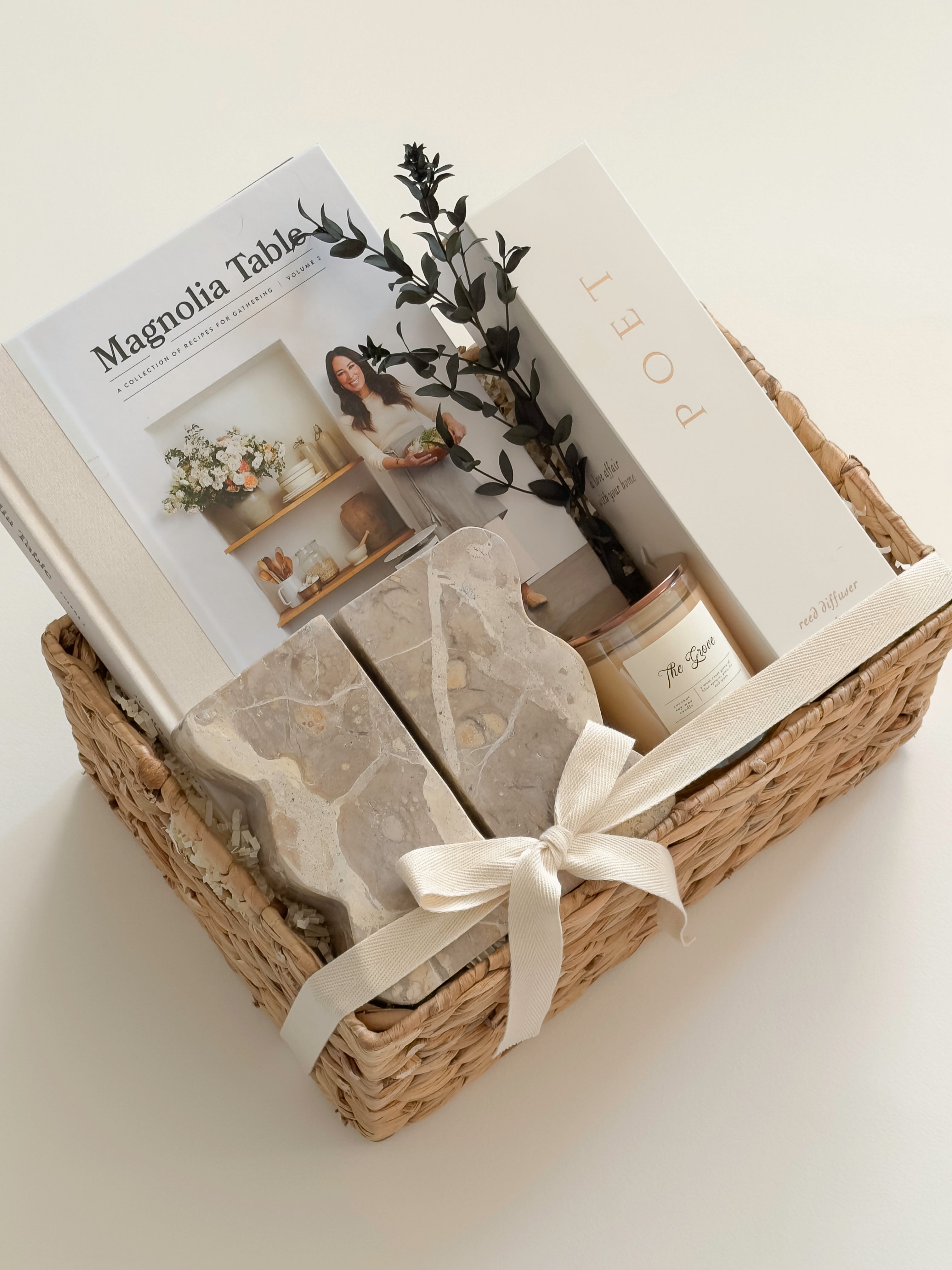 Luxury housewarming gift basket with Magnolia Table cookbook, sculptural home décor, candle and reed diffuser by Muse Baskets and Co.