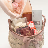 In Her Bloom gift basket featuring Rogers' Chocolates milk chocolate squares and Laura Slack artisan chocolate bar wrapped in Japanese Chiyogami paper by Muse Baskets and Co Vancouver