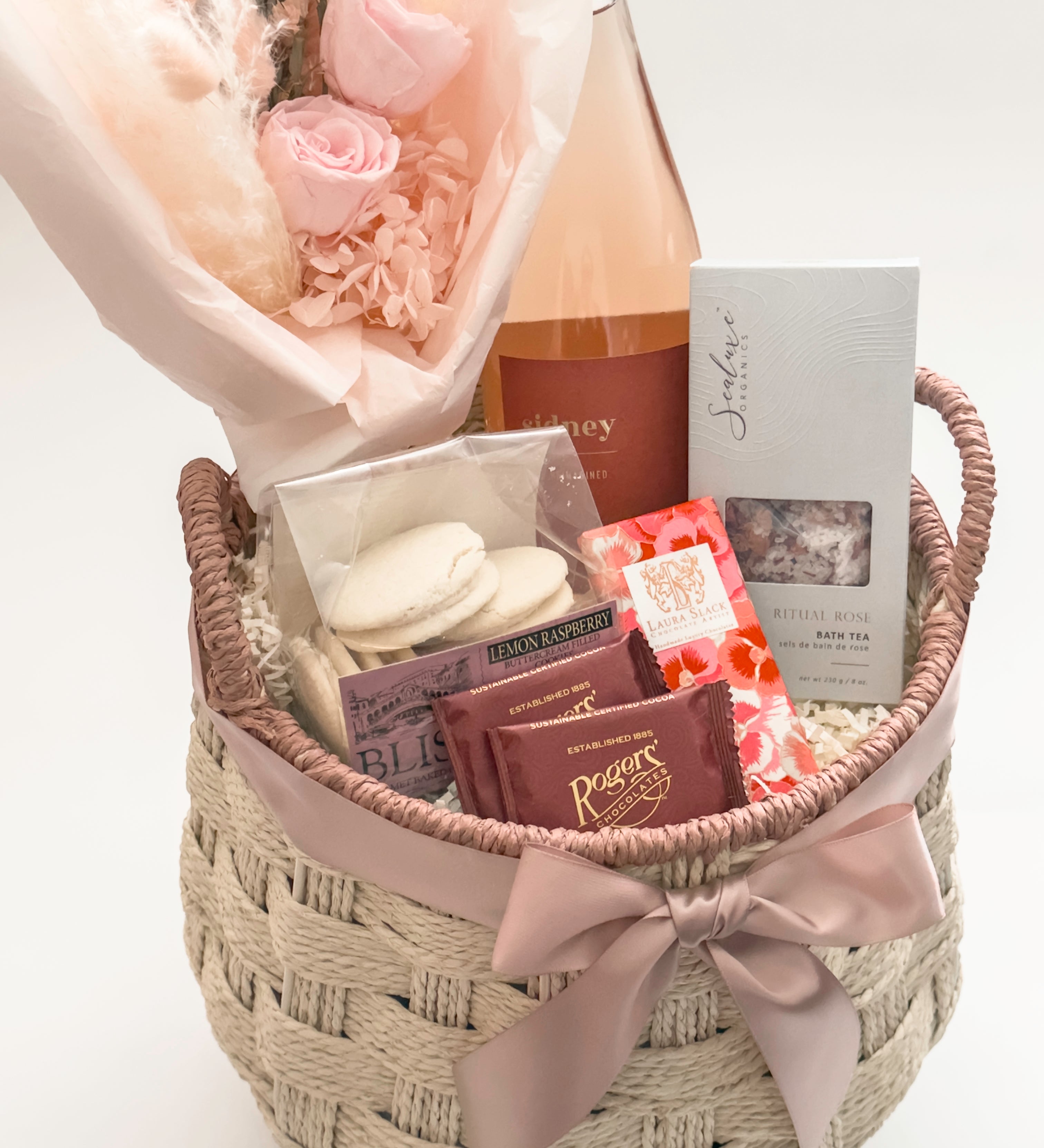 In Her Bloom gift basket featuring Rogers' Chocolates milk chocolate squares and Laura Slack artisan chocolate bar wrapped in Japanese Chiyogami paper by Muse Baskets and Co Vancouver