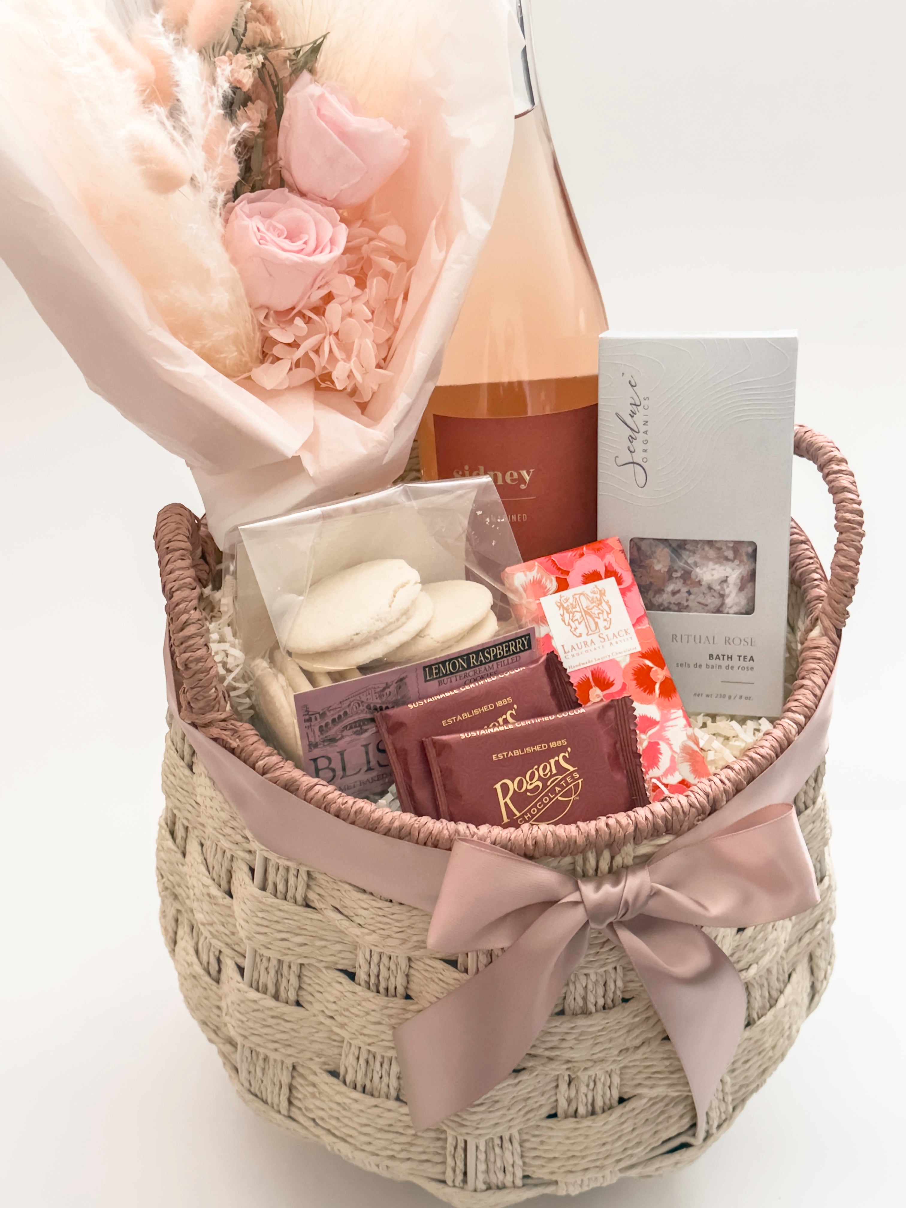 In Her Bloom gift basket featuring Rogers' Chocolates milk chocolate squares and Laura Slack artisan chocolate bar wrapped in Japanese Chiyogami paper by Muse Baskets and Co Vancouver