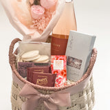 In Her Bloom gift basket with Bliss Gourmet lemon raspberry buttercream cookies and preserved blush rose bouquet by Hugme Florals for Mother's Day and women's client appreciation by Muse Baskets and Co Vancouver