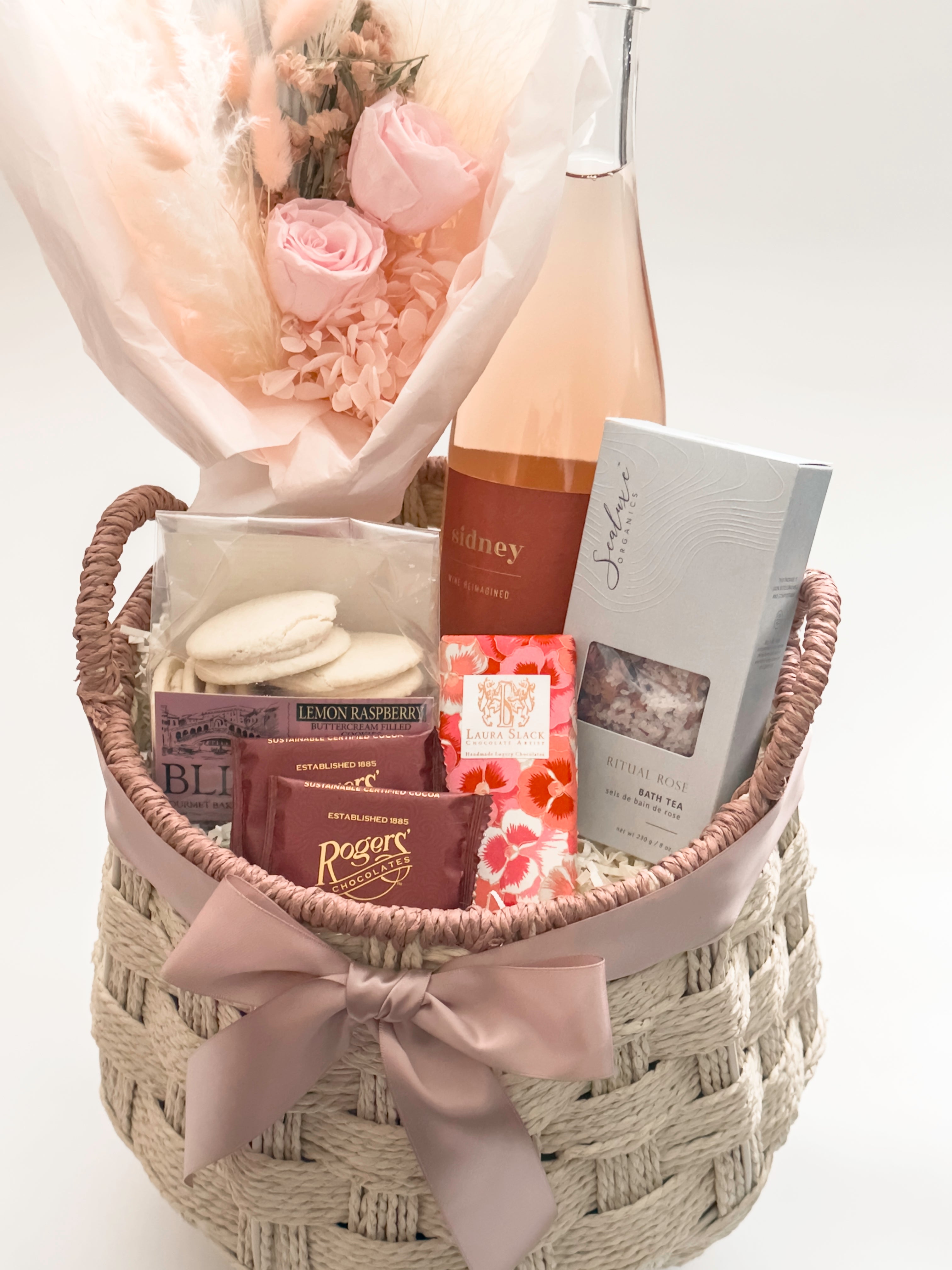 In Her Bloom gift basket with Bliss Gourmet lemon raspberry buttercream cookies and preserved blush rose bouquet by Hugme Florals for Mother's Day and women's client appreciation by Muse Baskets and Co Vancouver