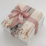 Avec Amour gift box elevated tier with MOA Turkish towel wrapped in blush satin ribbon by Muse Baskets and Co Vancouver