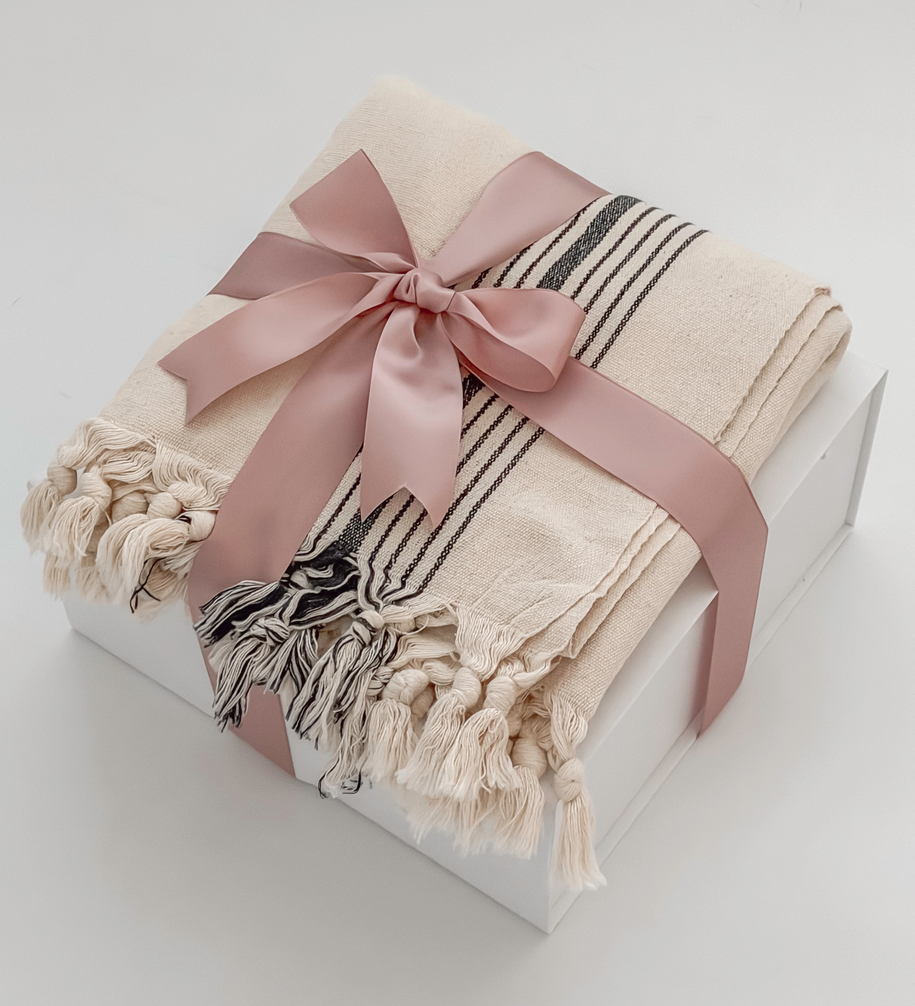 Avec Amour gift box elevated tier with MOA Turkish towel wrapped in blush satin ribbon by Muse Baskets and Co Vancouver