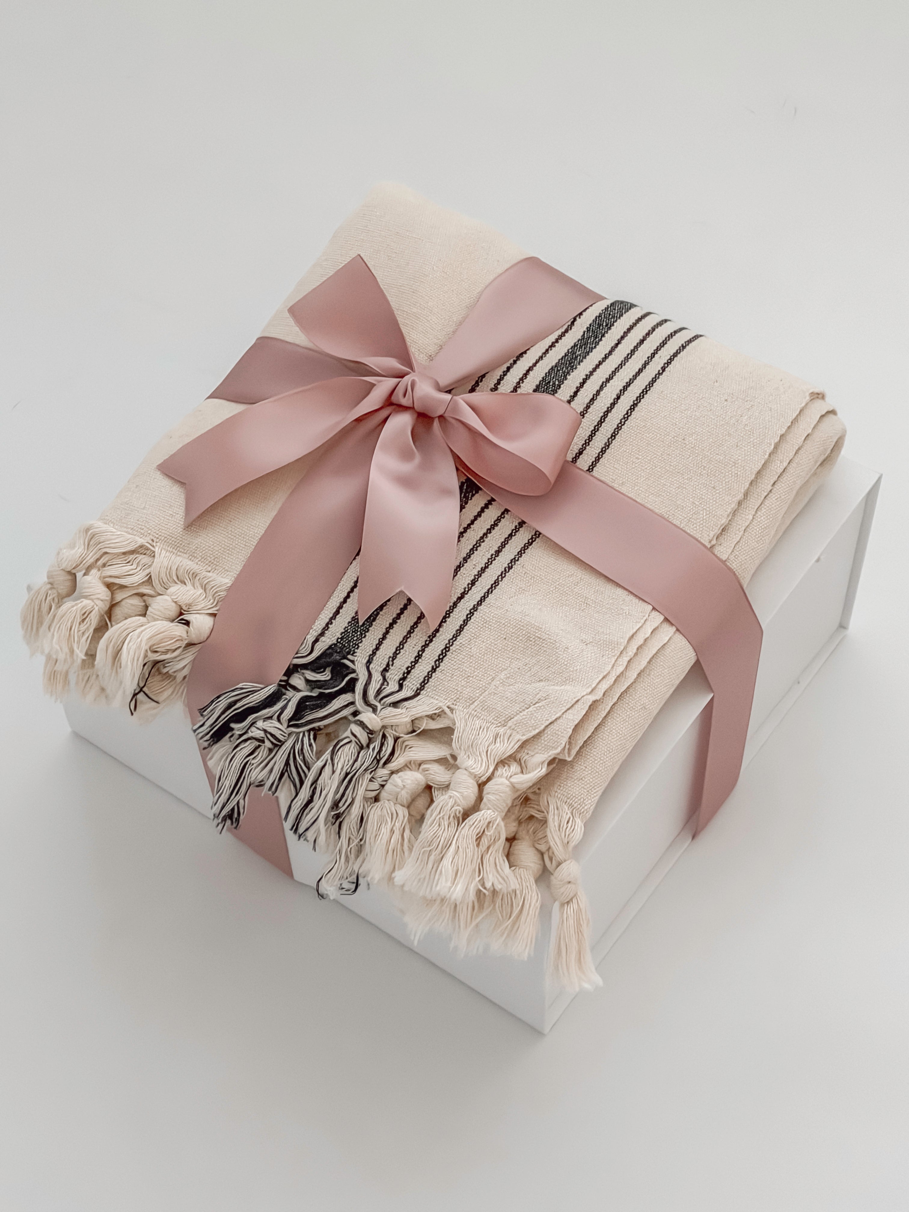 Avec Amour gift box elevated tier with MOA Turkish towel wrapped in blush satin ribbon by Muse Baskets and Co Vancouver