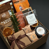 Cedar & Clove corporate holiday gift by Muse Baskets and Co. featuring SeaChange maple glazed salmon, Castello Brie and Parmesan & Garlic Crackers by Gone Crackers.