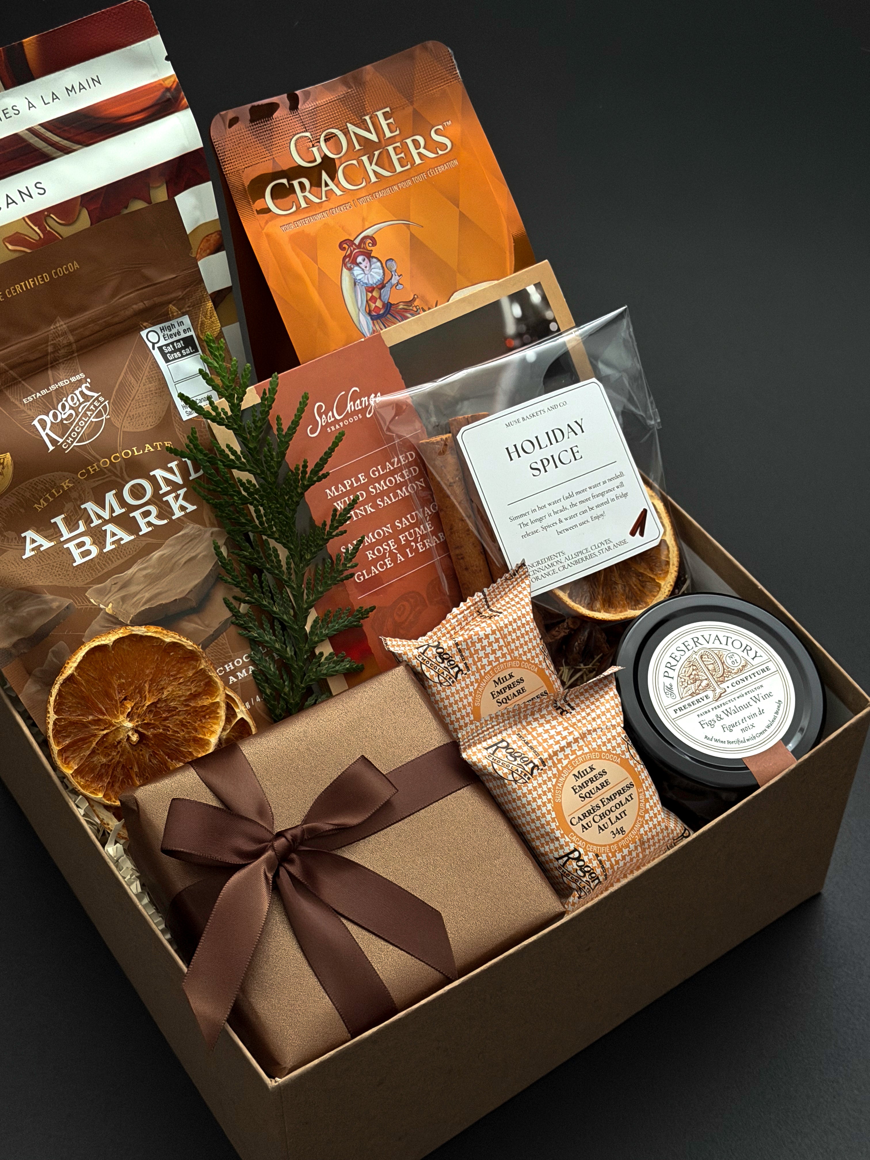 Cedar & Clove corporate holiday gift by Muse Baskets and Co. featuring SeaChange maple glazed salmon, Castello Brie and Parmesan & Garlic Crackers by Gone Crackers.