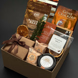 Cedar & Clove client appreciation gift box by Muse Baskets and Co. with Rogers’ milk chocolate almond bark, two Milk Empress Squares and Handfuel maple glazed pecans.