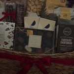 Holiday office share gift basket with chocolate, popcorn, and cookies.