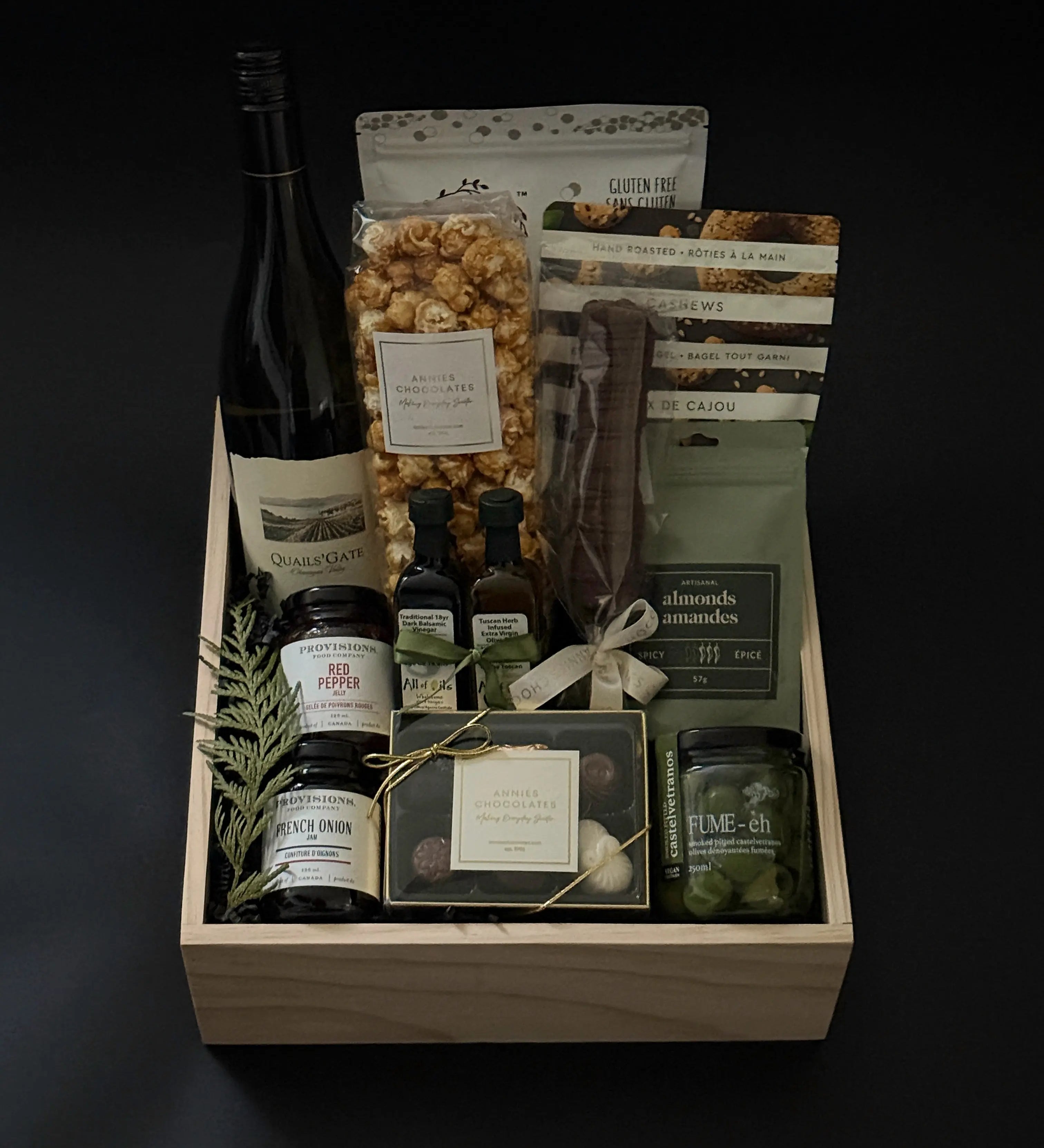 Luxury wine and gourmet gift box with Chardonnay, savoury pairings, and chocolates.