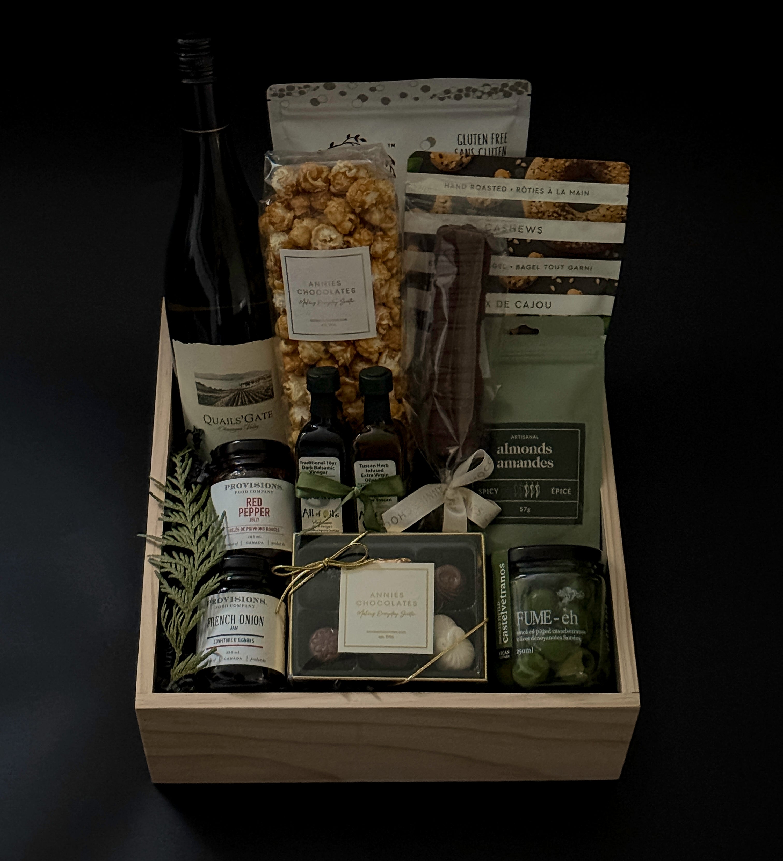 The Opulent Collection by Muse Baskets and Co. — luxury gift box featuring fine Chardonnay, artisan Canadian savouries, gourmet confections, and premium pantry essentials, elegantly arranged in a signature wood box.